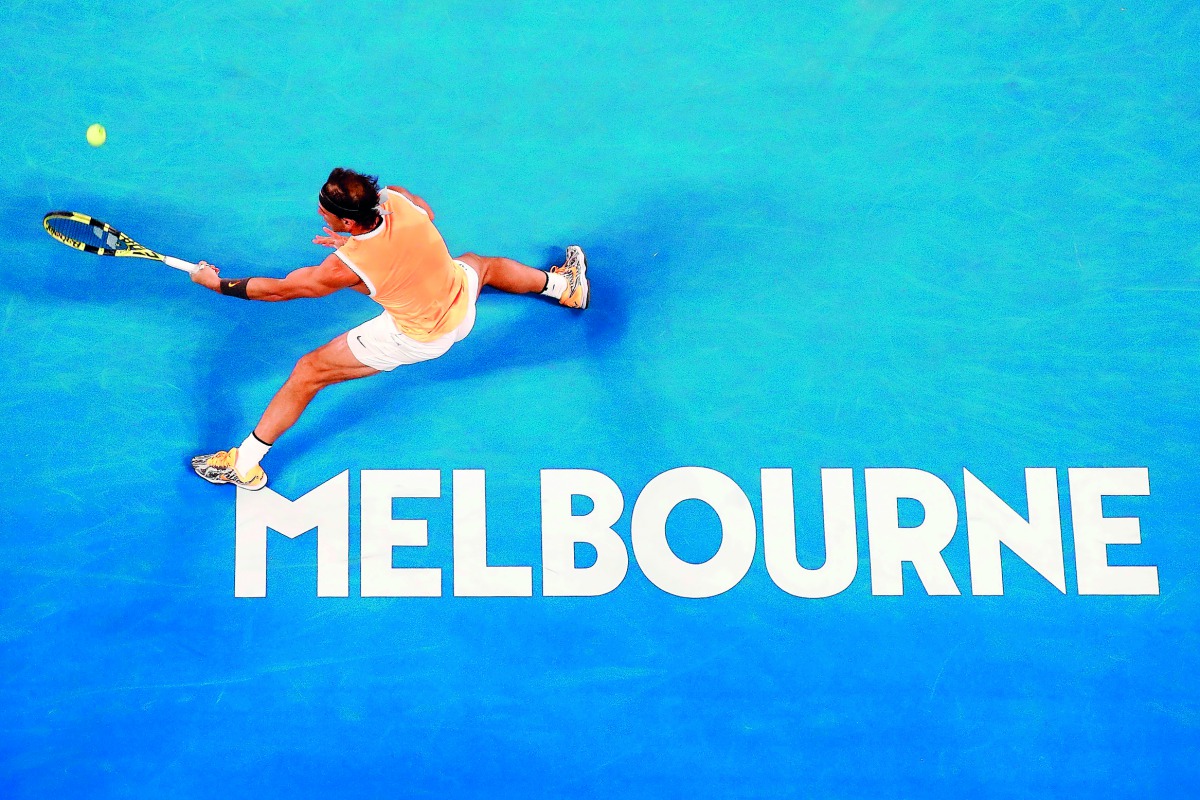 Spain’s Rafael Nadal hits a return against Australia’s Matthew Ebden during their men’s singles match on day three of the Australian Open in Melbourne, yesterday.