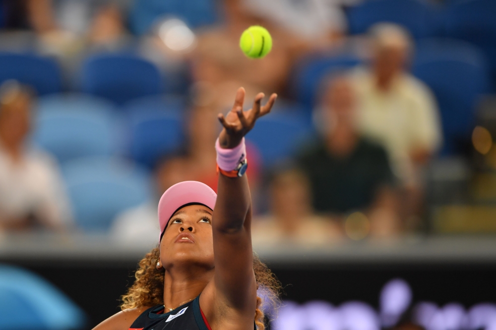 Japan's Naomi Osaka serves against Slovenia's Tamara Zidansek during their women's singles match on day four of the Australian Open tennis tournament in Melbourne on January 17, 2019.  AFP / Peter PARKS 