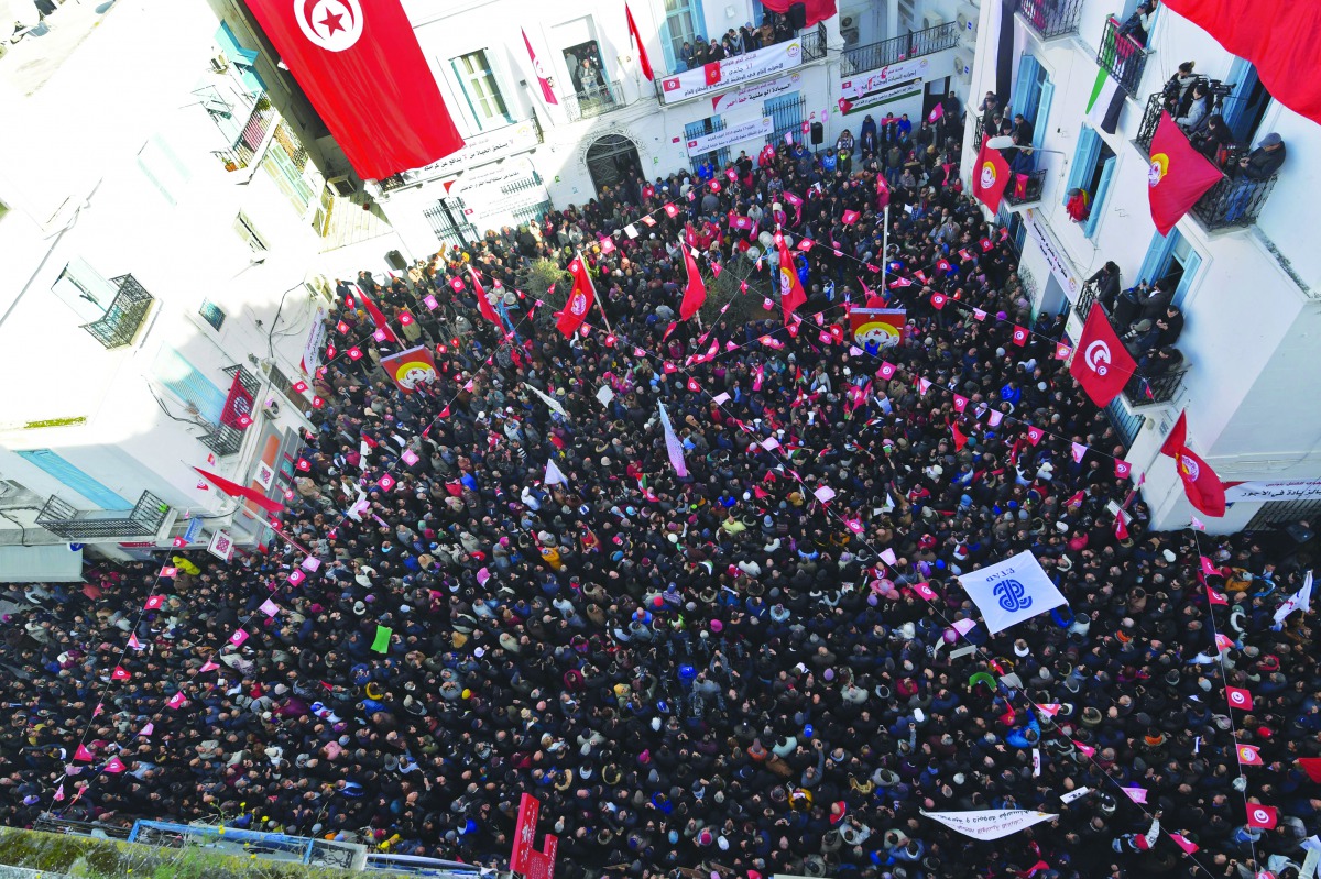 General Secretary of UGTT Noureddine Taboubi gives a speech at the union headquarters (UGTT) during a general strike in the capital Tunis on January 17, 2019.  AFP / Fethi Belaid

