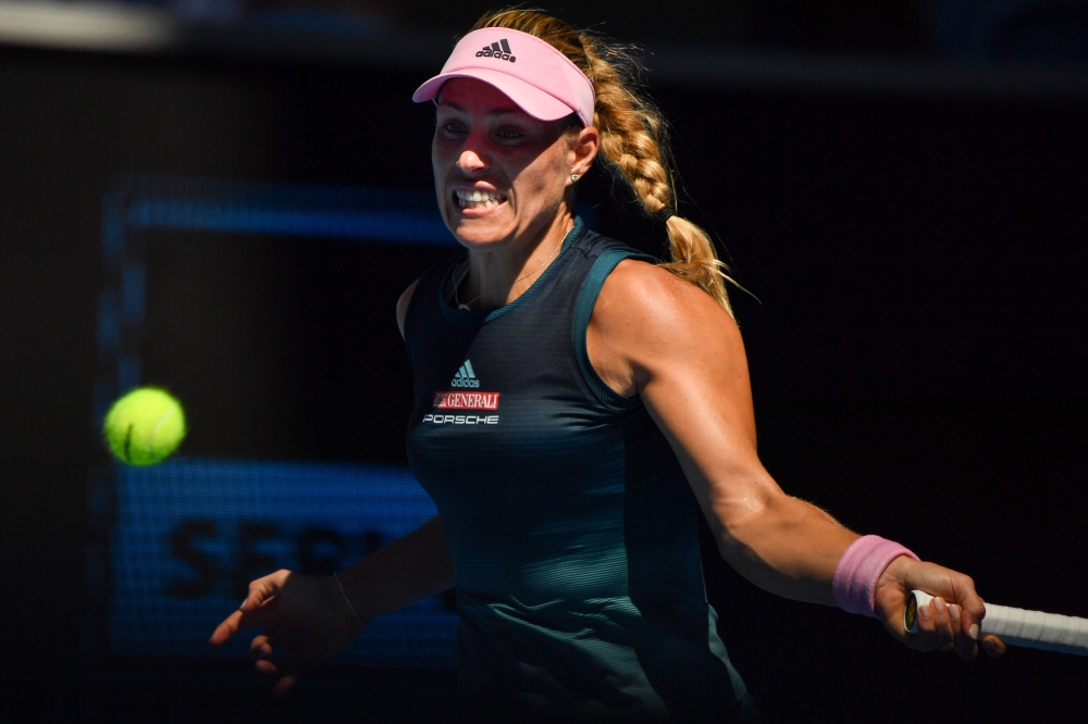 Germany's Angelique Kerber hits a return against Danielle Collins of the US during their women's singles match on day seven of the Australian Open tennis tournament in Melbourne on January 20, 2019. AFP / Peter Parks 