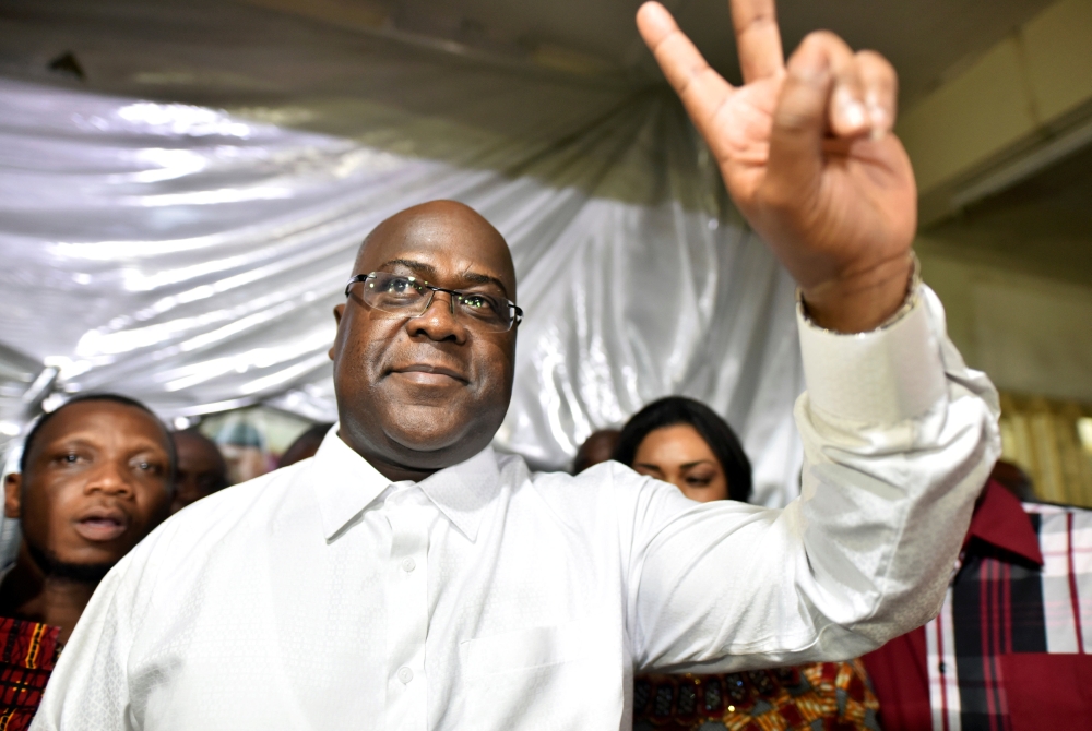 Felix Tshisekedi, leader of the Congolese main opposition party, the Union for Democracy and Social Progress who was announced as the winner of the presidential elections gestures to his supporters at the party headquarters in Kinshasa, Democratic Republi
