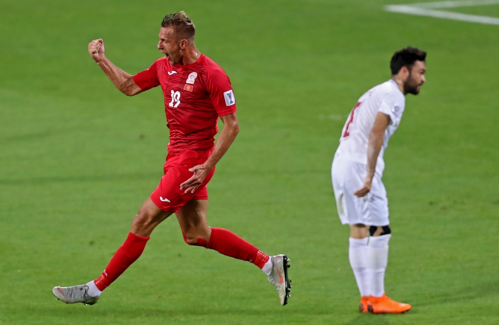 Kyrghyzstan's forward Vitalij Lux (L) celebrates after scoring a goal during the 2019 AFC Asian Cup group C match between Kyrgyzstan and Philippines at Maktoum Bin Rashid Al-Maktoum Stadium in Dubai on January 16, 2019. AFP