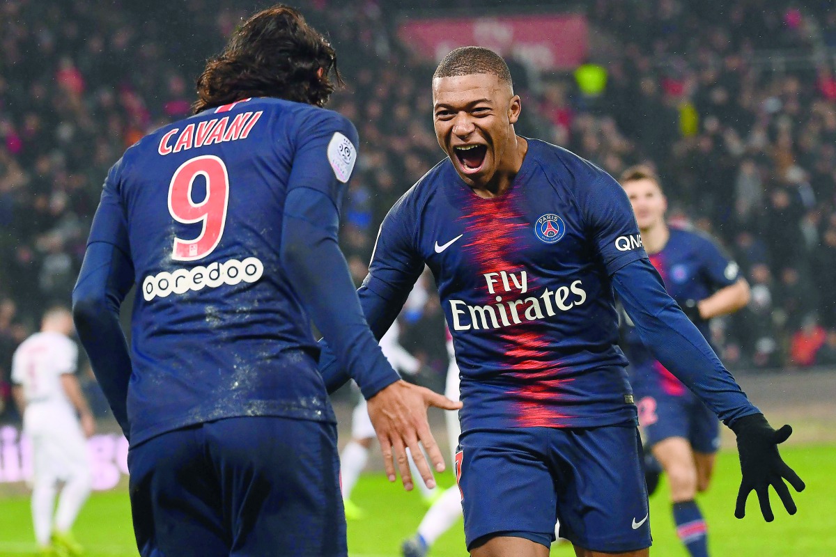 Paris Saint-Germain's French forward Kylian Mbappe celebrates after scoring a goal during the French L1 football match Paris Saint-Germain (PSG) vs Guingamp (EAG), on January 19, 2019 at the Parc des Princes stadium in Paris. AFP / Anne-Christine Poujoula
