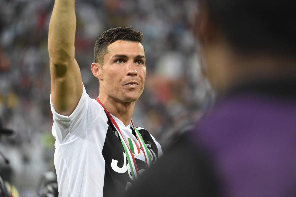 Juventus' Portuguese forward Cristiano Ronaldo greets the fans following the Supercoppa Italiana final between Juventus and AC Milan at the King Abdullah Sports City Stadium in Jeddah on January 16, 2019. / AFP / Fayez Nureldine