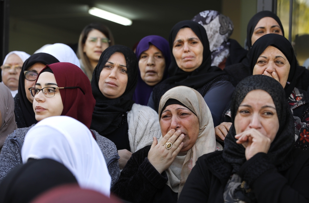 Mourners cry during the funeral of Arab-Israeli student Aya Maasarwe in the Arab-Israeli town of Baqa al-Gharbiya on January 23, 2019. AFP / Ahmad Gharabli  