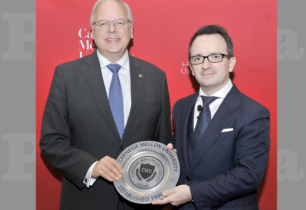 Michael Trick (left) Dean of Carnegie Mellon University in Qatar, presenting a token of recognition to Neil J Walsh, Chief Cybercrime and Anti-Money Laundering Section at UNODC, during a lecture on ‘Cyber Crimes Challenges and Prevention’, held at Carnegi