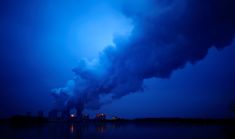 FILE PHOTO: Water vapour rises from the cooling towers of the Jaenschwalde lignite-fired power plant of Lausitz Energie Bergbau AG (LEAG) in Jaenschwalde, Germany, January 24, 2019. REUTERS/Hannibal Hanschke