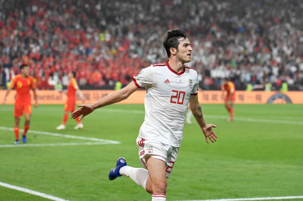 File photo of Iran's forward Sardar Azmoun celebrates his goal during the 2019 AFC Asian Cup quarter-final football match between China and Iran at the Mohammed Bin Zayed Stadium Stadium in Abu Dhabi on January 24, 2019. / AFP / Khaled DESOUKI 