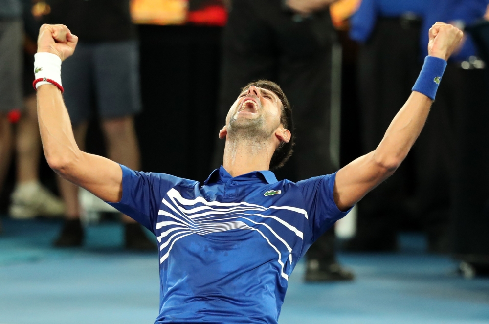 Serbia's Novak Djokovic celebrates after winning the match against Spain's Rafael Nadal. REUTERS/Lucy Nicholson