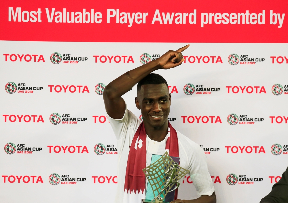 Qatar's Almoez Ali poses with the trophy for most valuable player of the tournament after winning the Asian Cup REUTERS/Thaier Al-Sudani