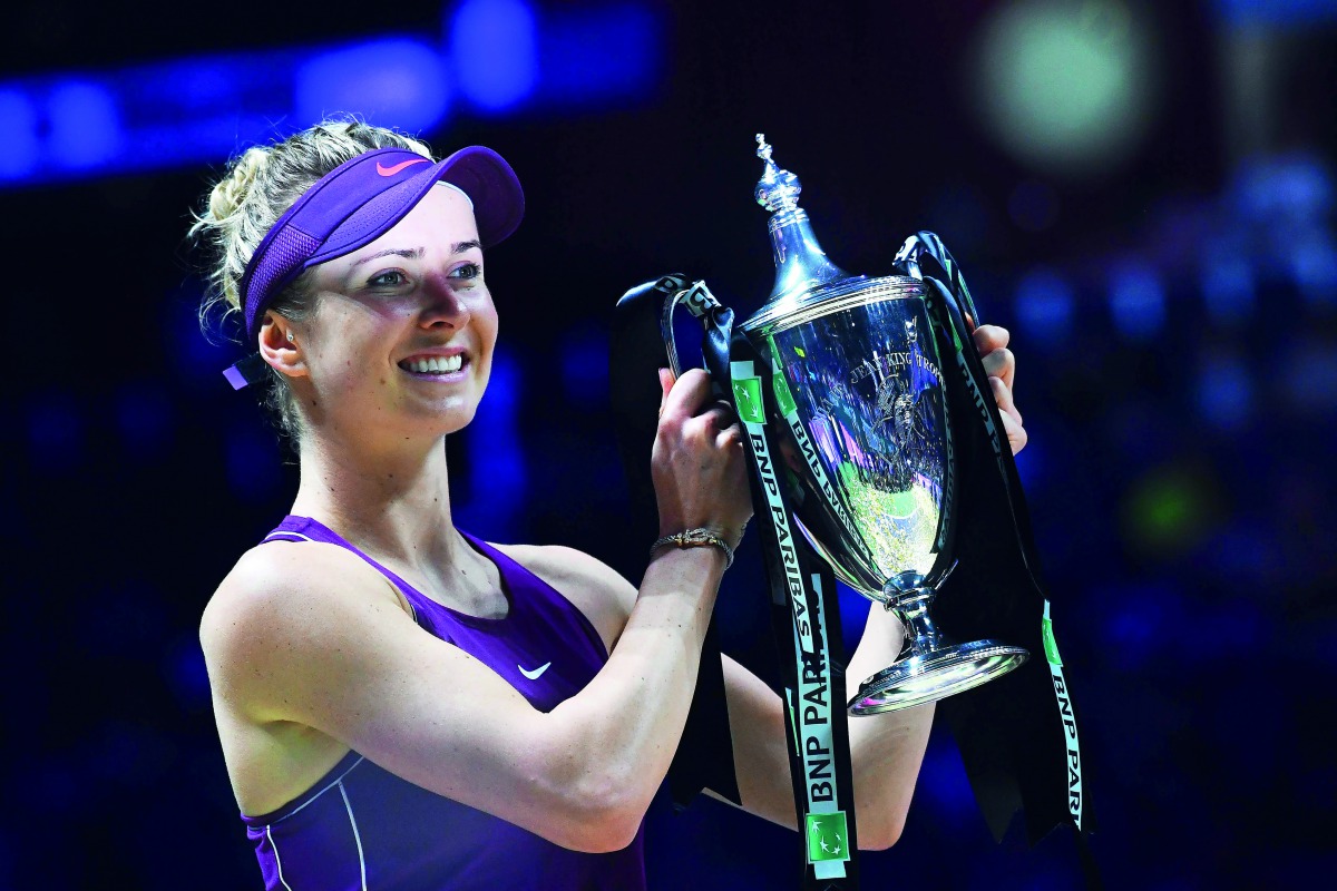 Ukraine’s Elina Svitolina holds up the winner’s trophy after defeating Sloane Stephens of the US in their singles final match at the WTA Finals in Singapore in this file picture.