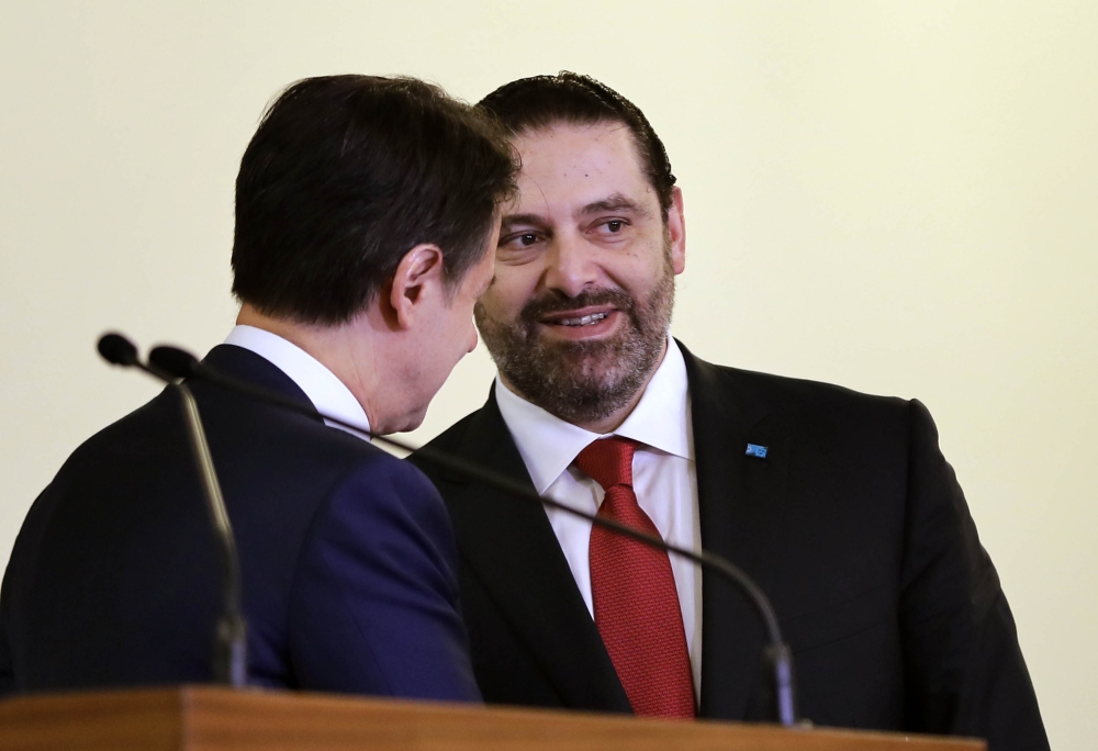 Lebanese Prime Minister Saad Hariri (R) and his Italian counterpart Giuseppe Conte give a joint press conference at the Grand Serail, the prime minister headquarters in Beirut, on February 7, 2019. / AFP / JOSEPH EID