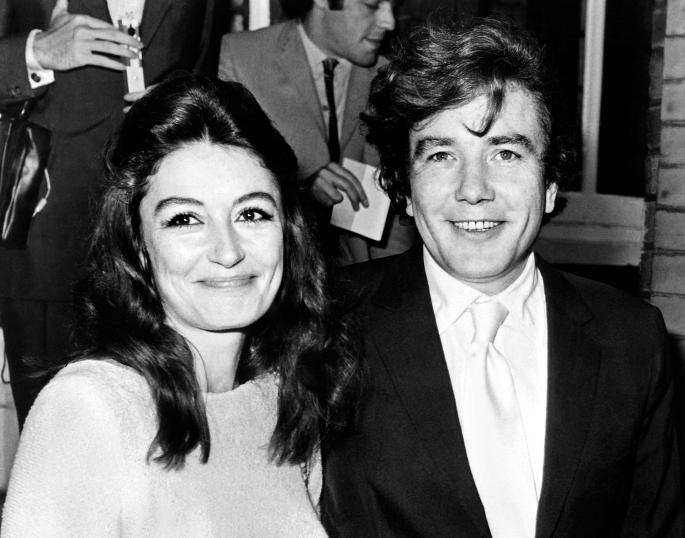 French actress Anouk Aimee (L) and British actor Albert Finney (R) pose after their wedding at Kensington registry office in London on August 8, 1970. AFP / Central Press 