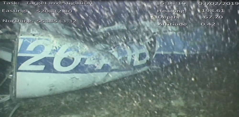 A handout video footage still image released by the UK Air Accidents Investigation Branch (AAIB) shows the rear left side of the fuselage, including part of the aircraft registration, identified as part of the wreckage from the missing Piper Malibu aircra