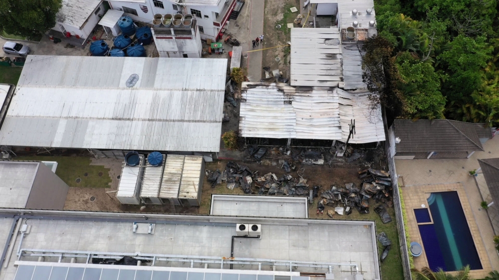 Aerial view of the Brazilian Flamengo football club training center after a building that housed players aged 14 to 17 caught fire at dawn in Vargem Grande neighborhood, west of Rio de Janeiro, Brazil, on February 8, 2019.  AFP / Marie HOSPITAL