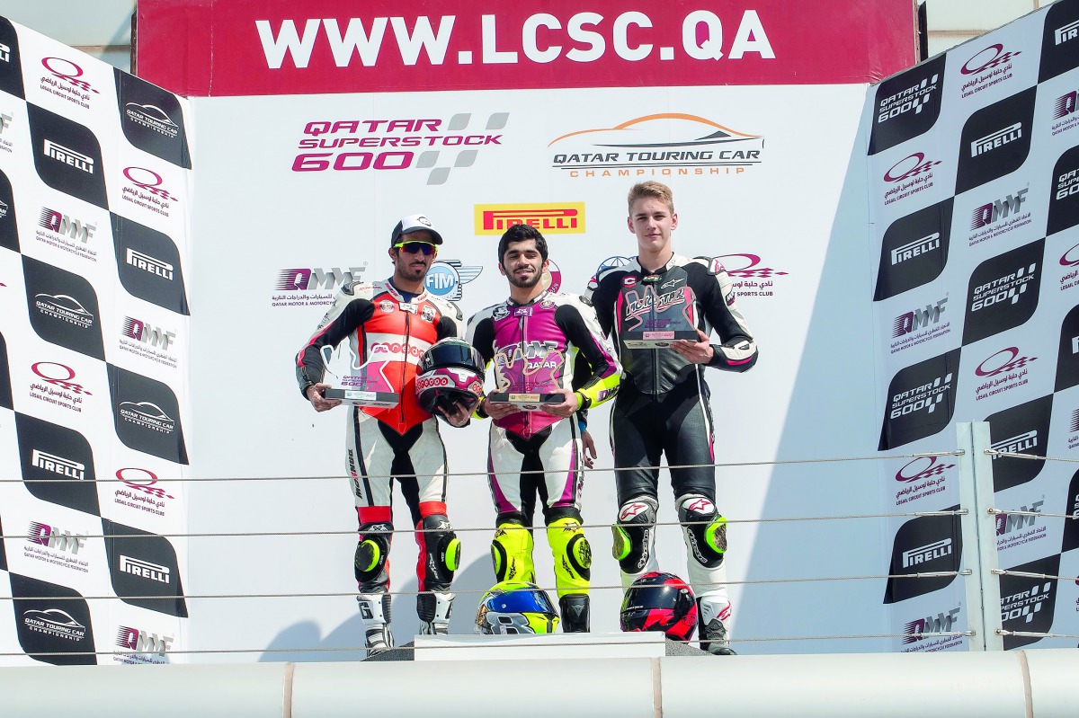 Abdulla Al Qubaisi (centre), Mishal Al Naimi (left) and Hungarian rider Balint Kovacs on the podium after the first fourth round race of Qatar Superstock 600 Championship at Losail International Circuit, yesterday. 