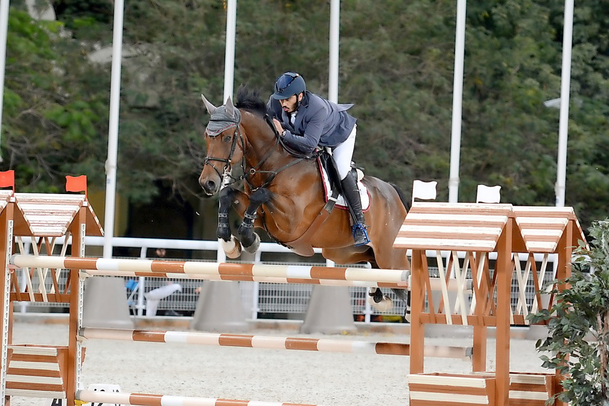 Saeed Nasser Al Qadi guides Daydreamer EC over an obstacle during the Big Tour competition in the 7th round of the Hathab Series yesterday. Pictures: Lotfi Garsi