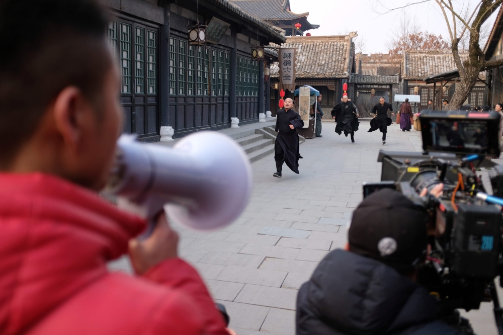In this photo taken on January 29, 2019, actors film a scene for a Chinese TV series at Hengdian World Studios in Dongyang. AFP / MATTHEW KNIGHT
