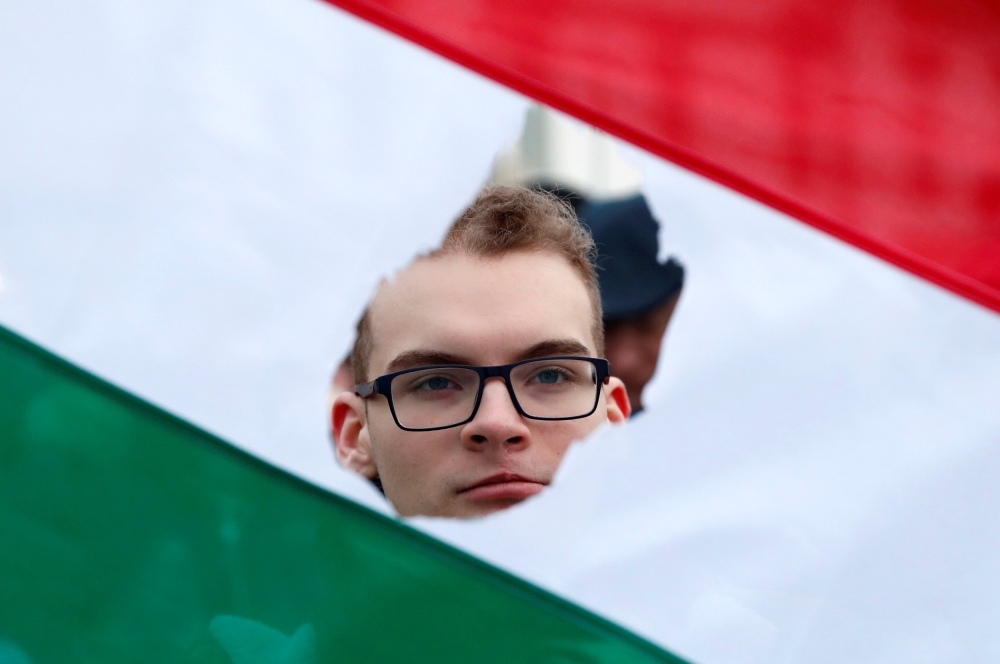 A demonstrator protests after Hungarian Prime Minister Viktor Orban delivered his annual state of the nation address in Budapest, Hungary, February 10, 2019. Reuters/Bernadett Szabo