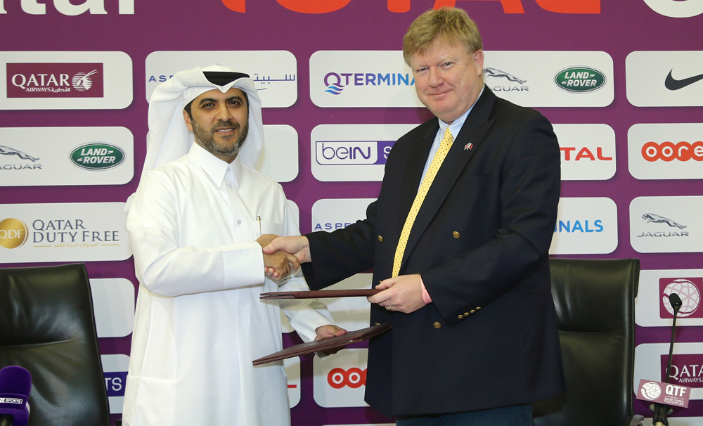 QTF Secretary General Tariq Zainal and Nivelle Bissett, CEO of QTerminals, shaking hands after the signing ceremony, yesterday. 