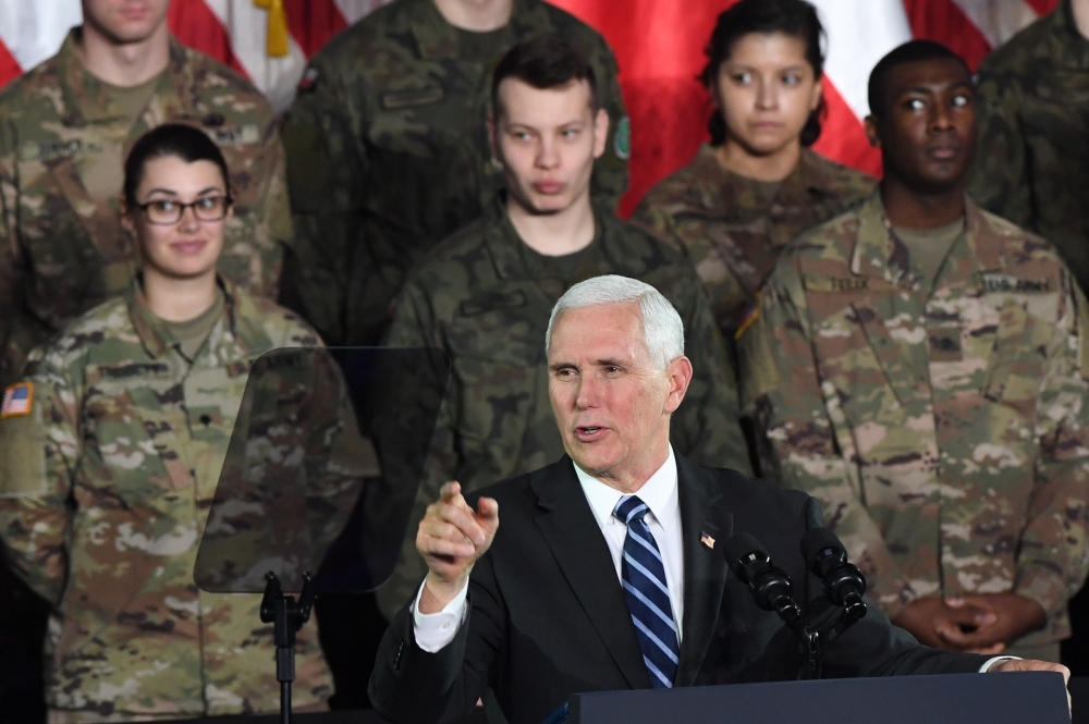 US Vice President Mike Pence delivers a speech at the 1st Airlift Base in Warsaw, on February 13, 2019 during a three-day visit of the US Vice President to Poland. AFP / Janek Skarzynski 