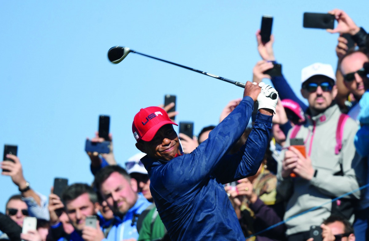 Tiger Woods plays a tee shot during the 42nd Ryder Cup at Le Golf National Course at Saint-Quentin-en-Yvelines, southwest of Paris, on September 30, 2018. AFP / Franck Fife
