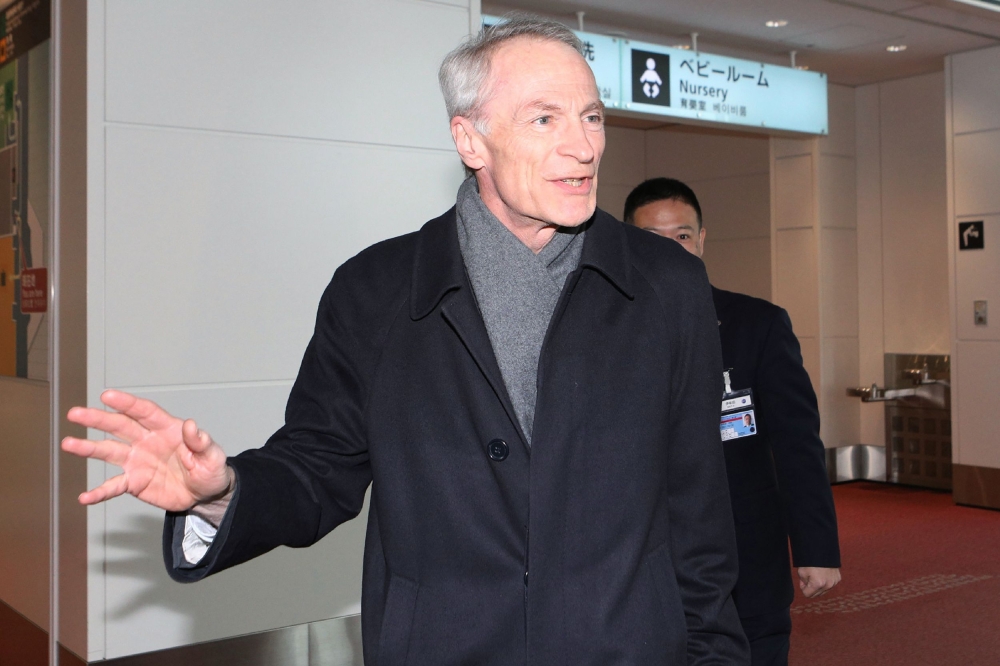Newly appointed Renault CEO Jean-Dominique Senard speaks to journalists upon his arrival at Haneda International airport in Tokyo on February 14, 2019. - AFP 
