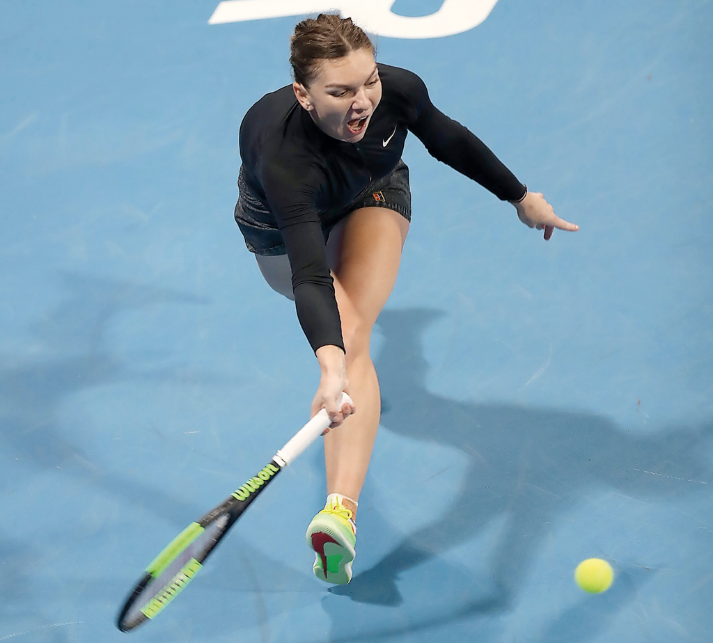Romanian World No. 3 Simona Halep hits a return against Germany’s Julia Goerges during her quarter-final match of the Qatar Total Open at the Khalifa International Tennis and Squash Complex, in Doha, yesterday.