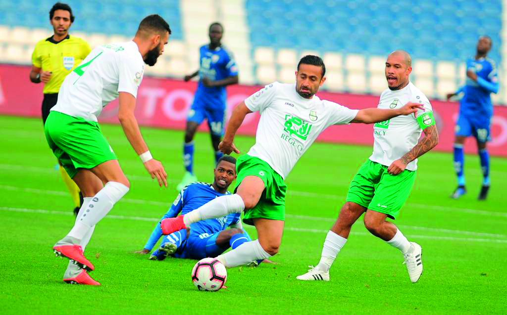 Al Ahli’s Omid Amir Ebrahimi (centre) controls the ball during the QNB Stars League match against Al Kharaitiyat at the Al Khor Stadium, yesterday. Al Ahli won 2-1.
