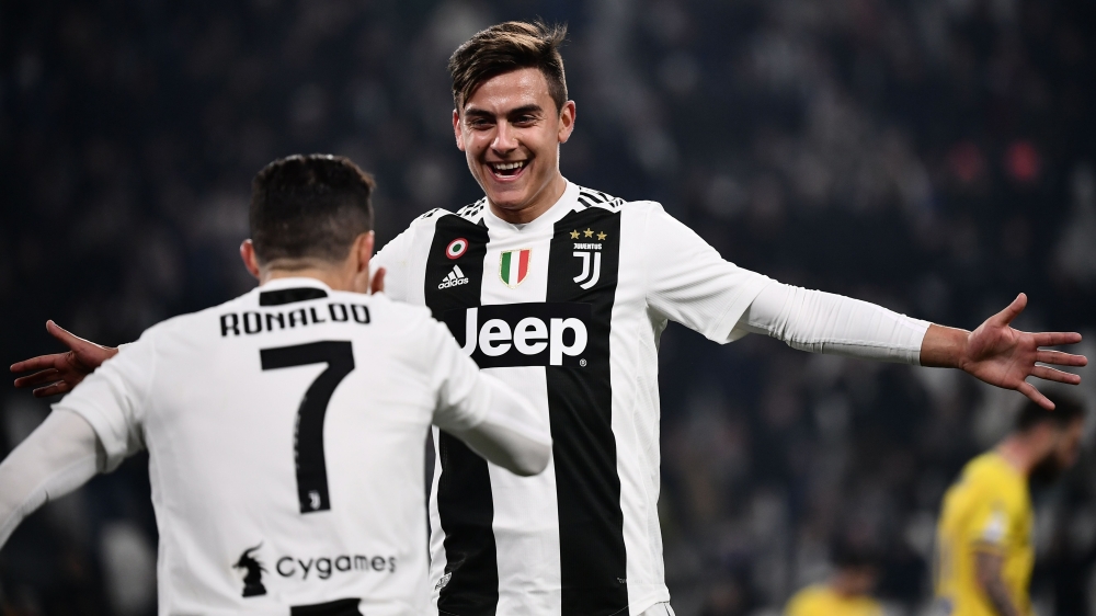 Juventus' Portuguese forward Cristiano Ronaldo (L) celebrates with Juventus' Argentine forward Paulo Dybala after scoring during the Italian Serie A football match Juventus vs Frosinone on February 15, 2019 at the Juventus stadium in Turin. / AFP / Marco 
