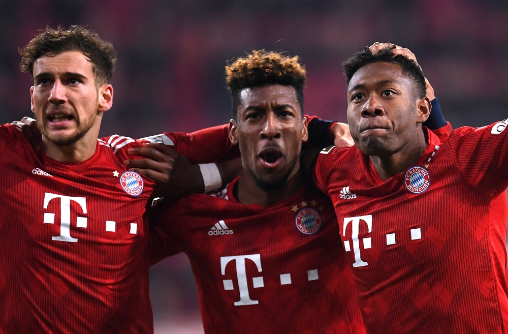 Bayern Munich's David Alaba celebrates scoring their third goal with Kingsley Coman and Leon Goretzka REUTERS/Andreas Gebert