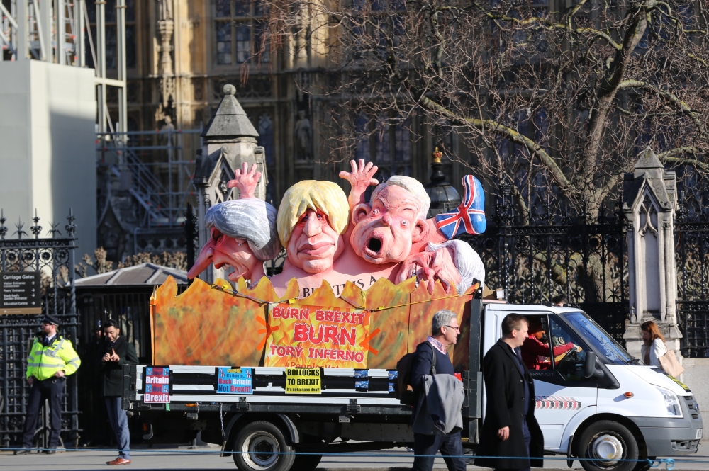 Anti and pro Brexit activists demonstrate, as British parliament votes on governments Brexit motion and a number of amendments which aim to reshape it, around the parliamentary estate in London, England on February 14, 2019. ( Tayfun Salc? - Anadolu Agenc