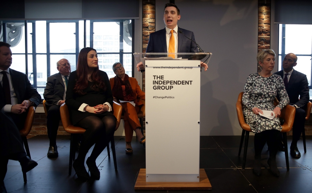 Former Labour party MPs Chris Leslie (L), Mike Gapes (2L), Luciana Berger (3L), Ann Coffey (4L), Angela Smith (2R) and Chuka Umunna (R) listen as Gavin Shuker speaks during a press conference in London on February 18, 2019, where he and colleagues announc