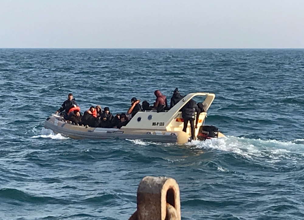British rescuers helping some 20 migrants on a semi-rigid boat trying make their way from France across the English Channel  on February 18, 2019.  AFP/Societe Nationale de Sauvetage en Mer