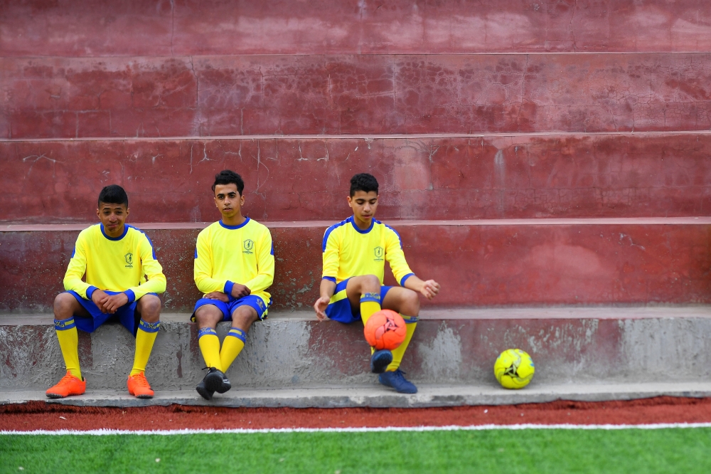 Moatasem Al-Nabeeh, 14, who is diagnosed with cancer, warms up before playing soccer with fellow cancer patients in Gaza City, February 15, 2019. Reuters/Dylan Martinez 