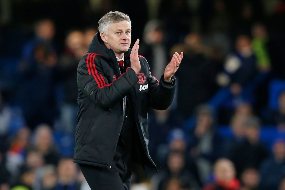 Manchester United's Norwegian caretaker manager Ole Gunnar Solskjaer applauds supporters on the pitch after the English FA Cup fifth round football match between Chelsea and Manchester United at Stamford Bridge in London on February 18, 2019. AFP / Ian Ki