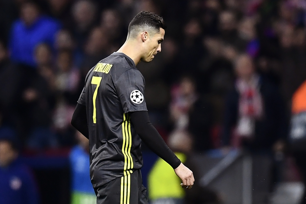 Juventus' Portuguese forward Cristiano Ronaldo reacts during the UEFA Champions League round of 16 first leg football match between Club Atletico de Madrid and Juventus FC at the Wanda Metropolitan stadium in Madrid on February 20, 2019. / AFP / OSCAR DEL