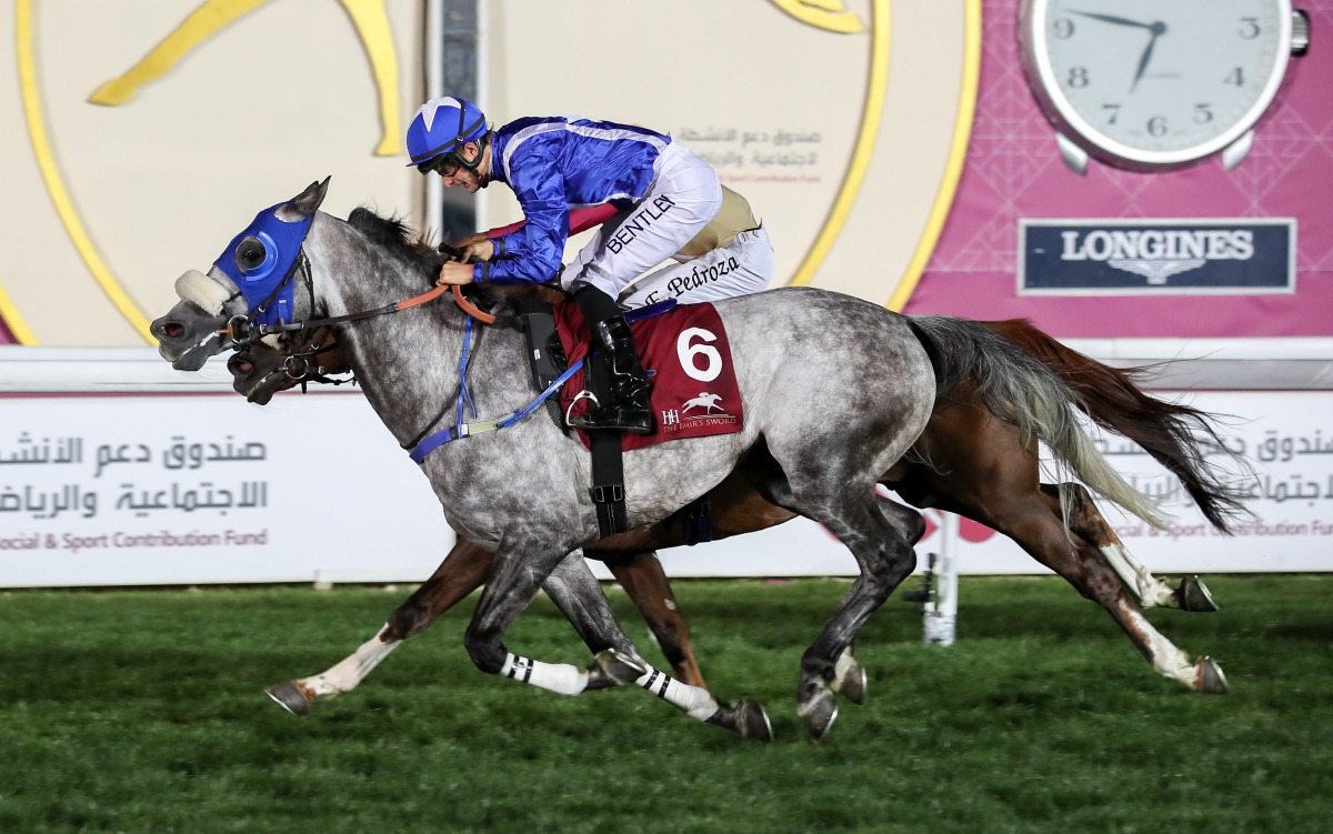 Jockey Harry Bentley guides Ishfaq to win the Al Zubara Trophy on the opening day of the Amir’s Sword Festival at Qatar Racing and Equestrian Club, yesterday.