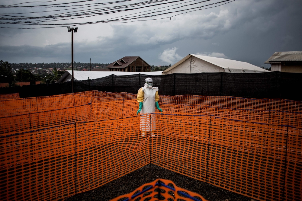 FILE PHOTO: A health worker waits to handle a new unconfirmed Ebola patient at a newly build MSF (Doctors Without Borders) supported Ebola treatment centre (ETC) in Bunia, Democratic Republic of the Congo. November 7, 2018. AFP / John WESSELS
