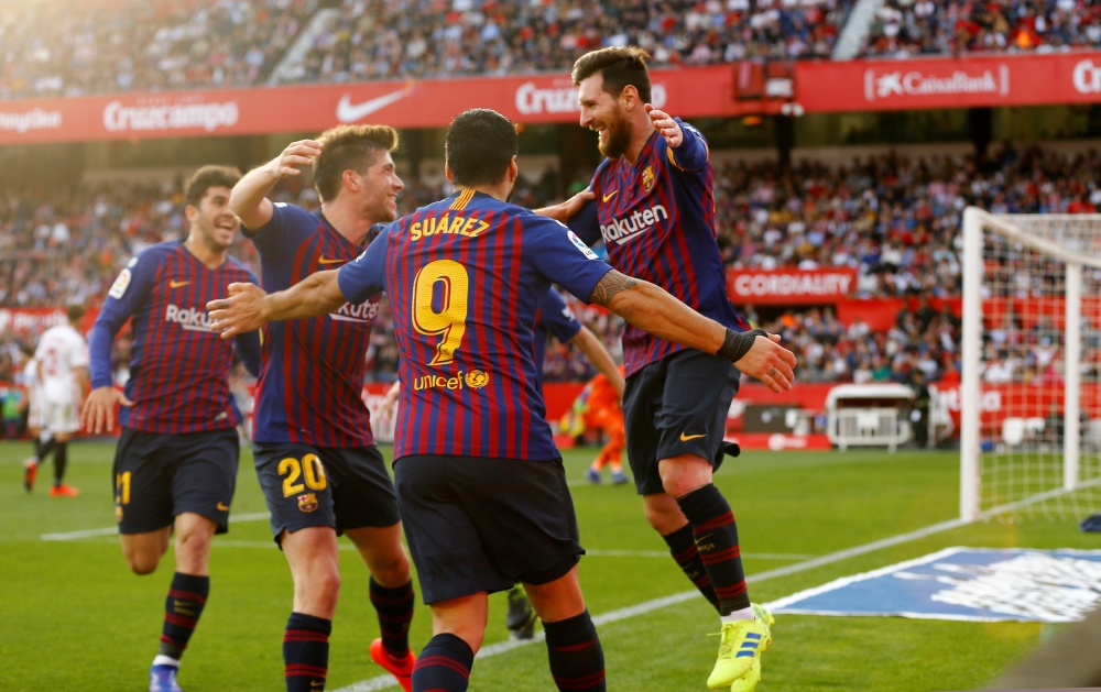 Barcelona's Lionel Messi celebrates scoring their third goal to complete his hat-trick REUTERS/Marcelo del Pozo