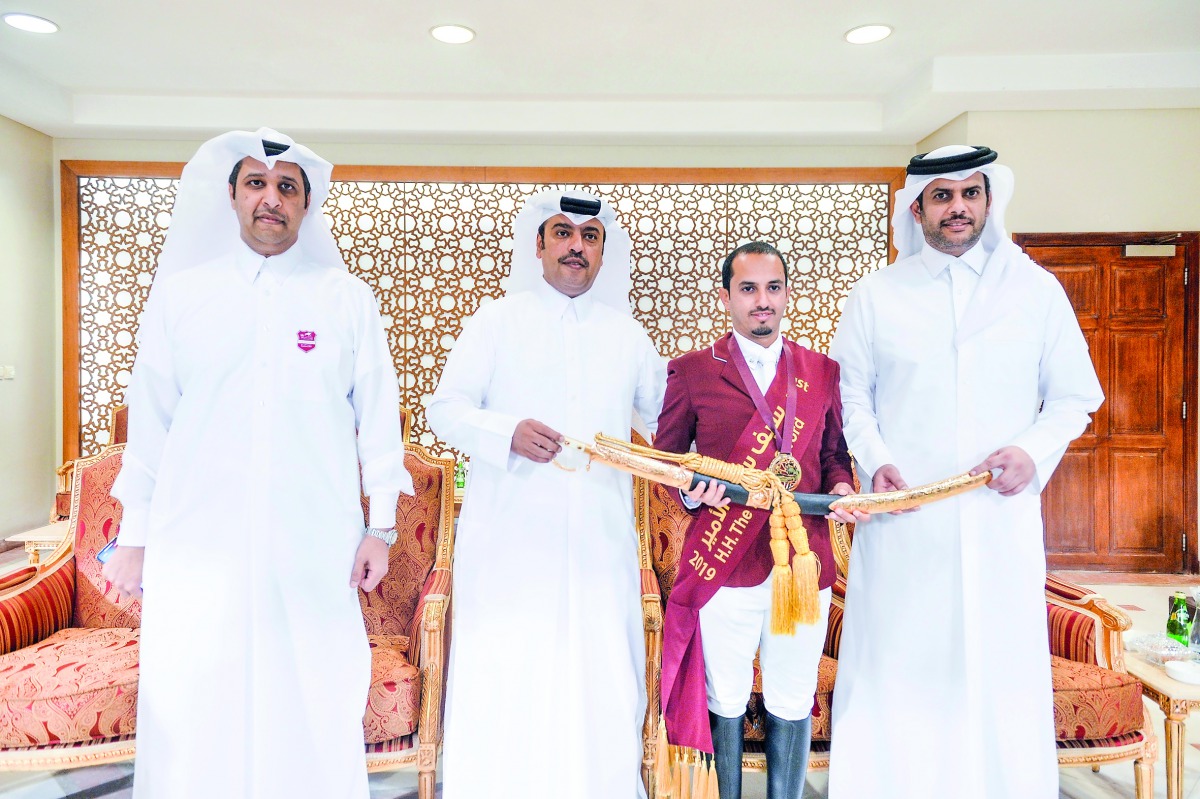 Faleh Suwead Al Ajami is seen with QEF President Hamad Abdulrahman Al Attiyah after winning the Amir’s Golden Sword on the final day of the three-day Show Jumping Festival at the Outdoor Arena of the Qatar Equestrian Federation (QEF). 