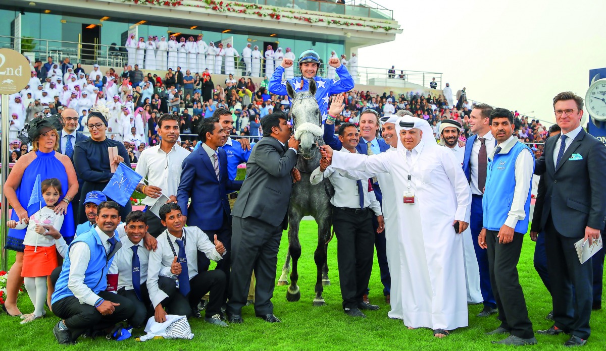 Ebraz’s team celebrates winning the Amir’s Golden Sword at the Qatar Racing and Equestrian Club, yesterday.