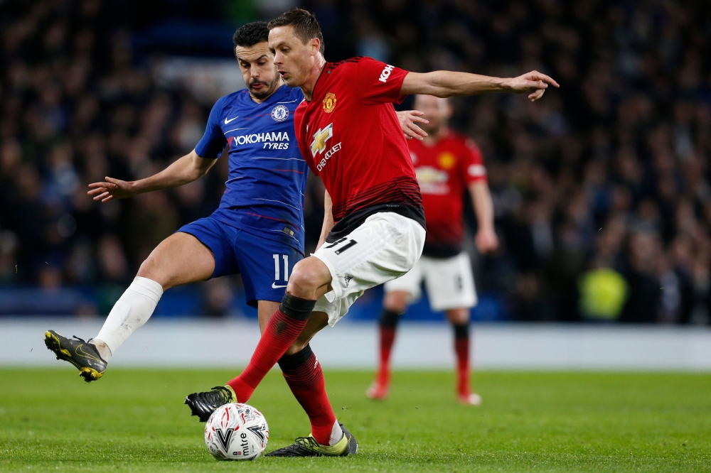 Chelsea's Spanish midfielder Pedro (L) vies with Manchester United's Serbian midfielder Nemanja Matic (R) during the English FA Cup fifth round football match between Chelsea and Manchester United at Stamford Bridge in London on February 18, 2019.   AFP /