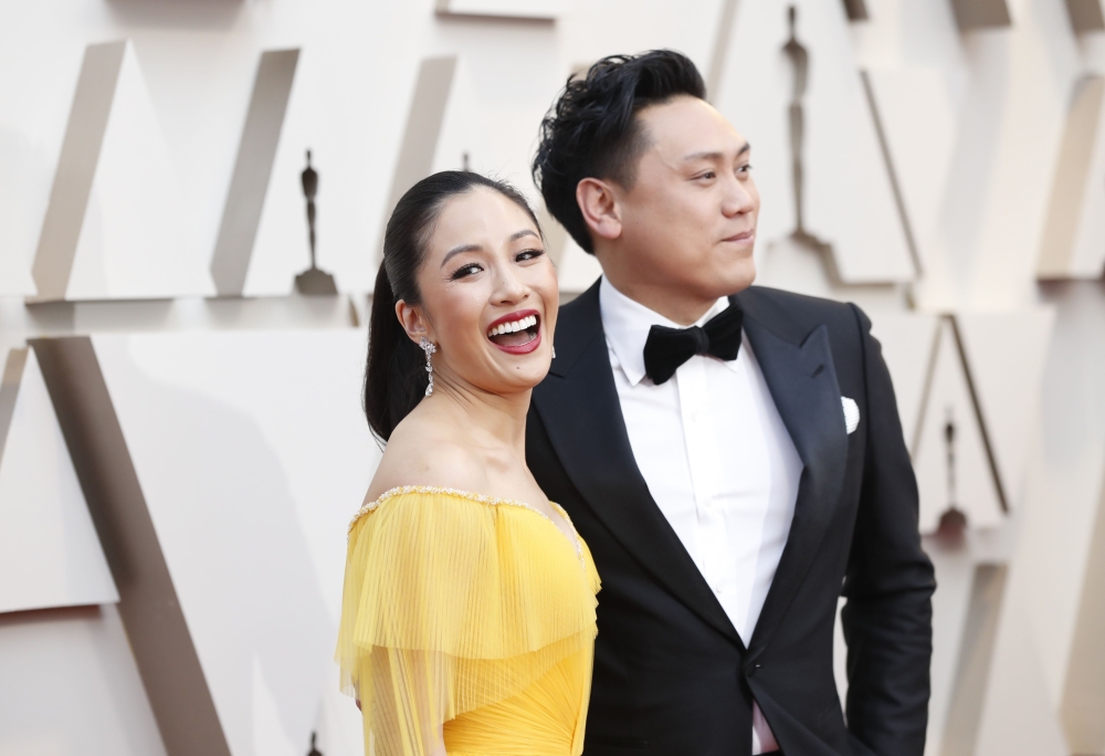 Constance Wu and director Jon Chu arrive. REUTERS/Mario Anzuoni