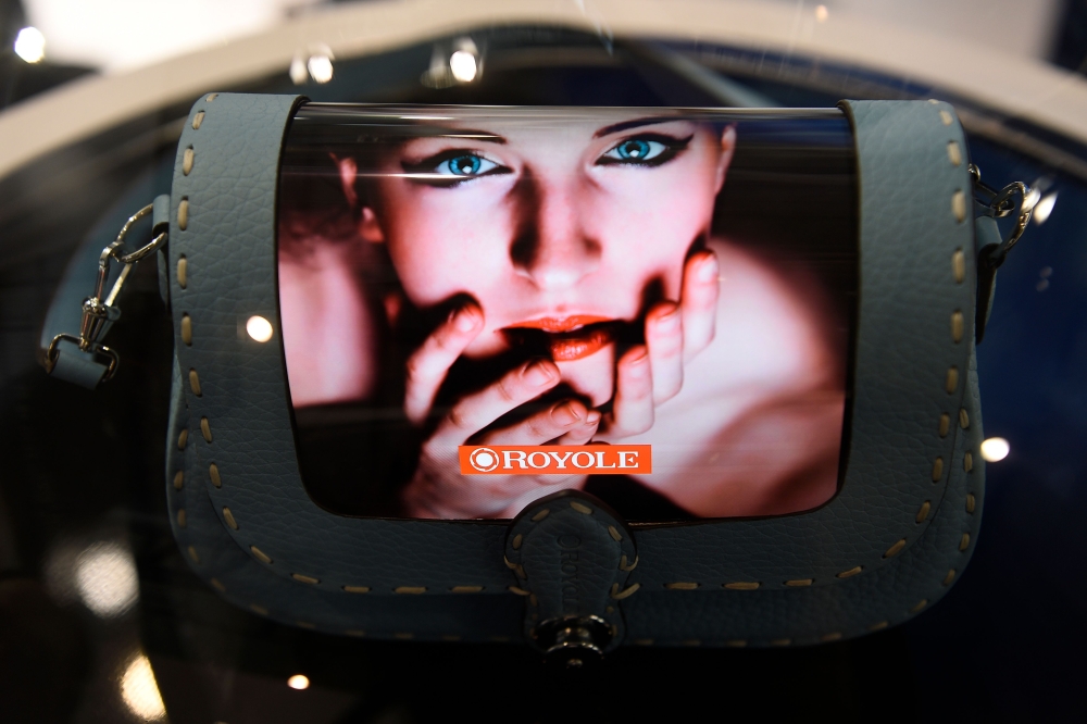 A purse featuring Royole's foldable mobile device FlexiPai is displayed at the Mobile World Congress (MWC) in Barcelona on February 25, 2019.  AFP / Lluis Gene 
