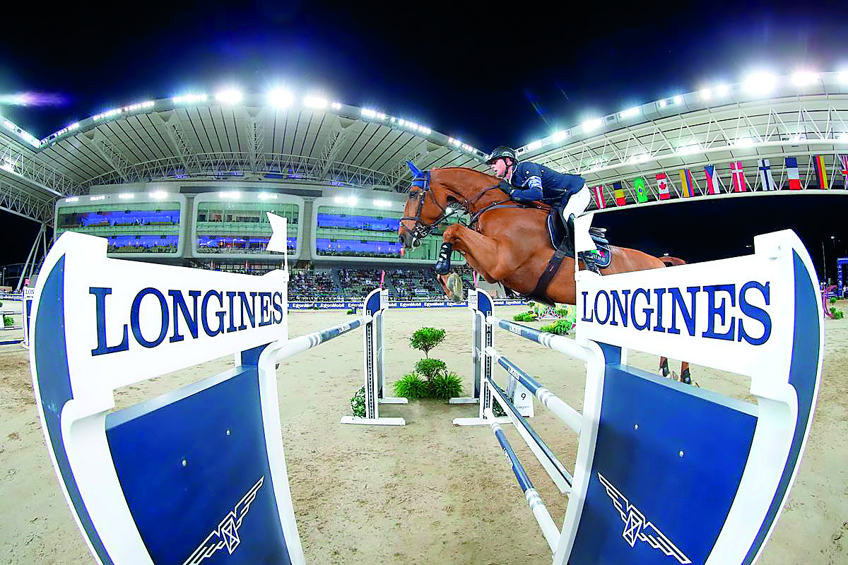 British rider Ben Maher guides Explosion W over an obstacle on his way to winning the LGCT Grand Prix at Al Shaqab Arena in this file photo.