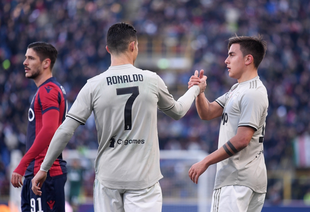 Juventus' Cristiano Ronaldo celebrates after the match with Paulo Dybala REUTERS/Alberto Lingria
