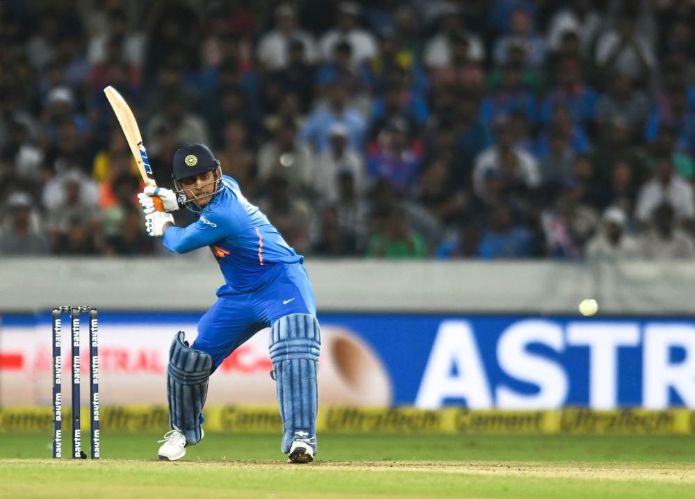 Indian cricketer Mahendra Singh Dhoni plays a shot during the first one day international (ODI) cricket match between India and Australia at the Rajiv Gandhi International Cricket Stadium in Hyderabad on March 2, 2019. (AFP / NOAH SEELAM)