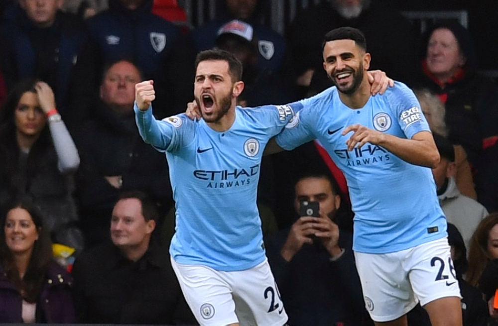 Manchester City's Riyad Mahrez celebrates scoring their first goal with Bernardo Silva REUTERS/Dylan Martinez 