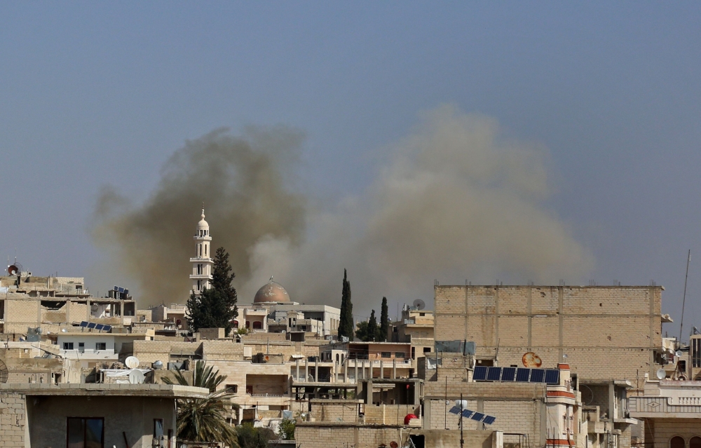 Smoke billows following reported shelling in the town of Khan Sheikhun in the southern countryside of the rebel-held Idlib province, on February 26, 2019. AFP / Anas AL-DYAB